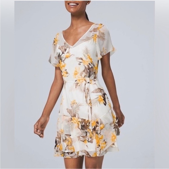 White House Black Market Dresses & Skirts - WHBM white and yellow floral print dress with ruffle hem and slit sleeves